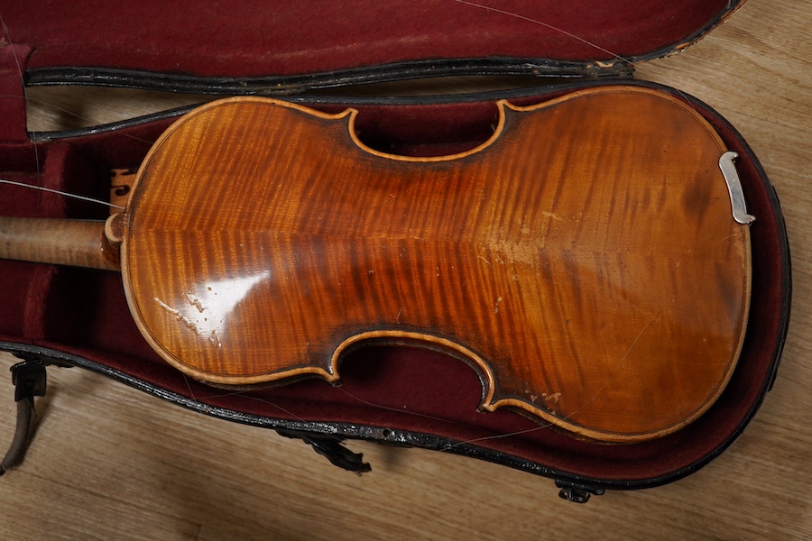 Two cased violins; one French 19th century bearing a hand written label for Francesco Werentle 1746, body length 35.5cm, the other an early 20th century violin, body length 35cm. Condition - poor.